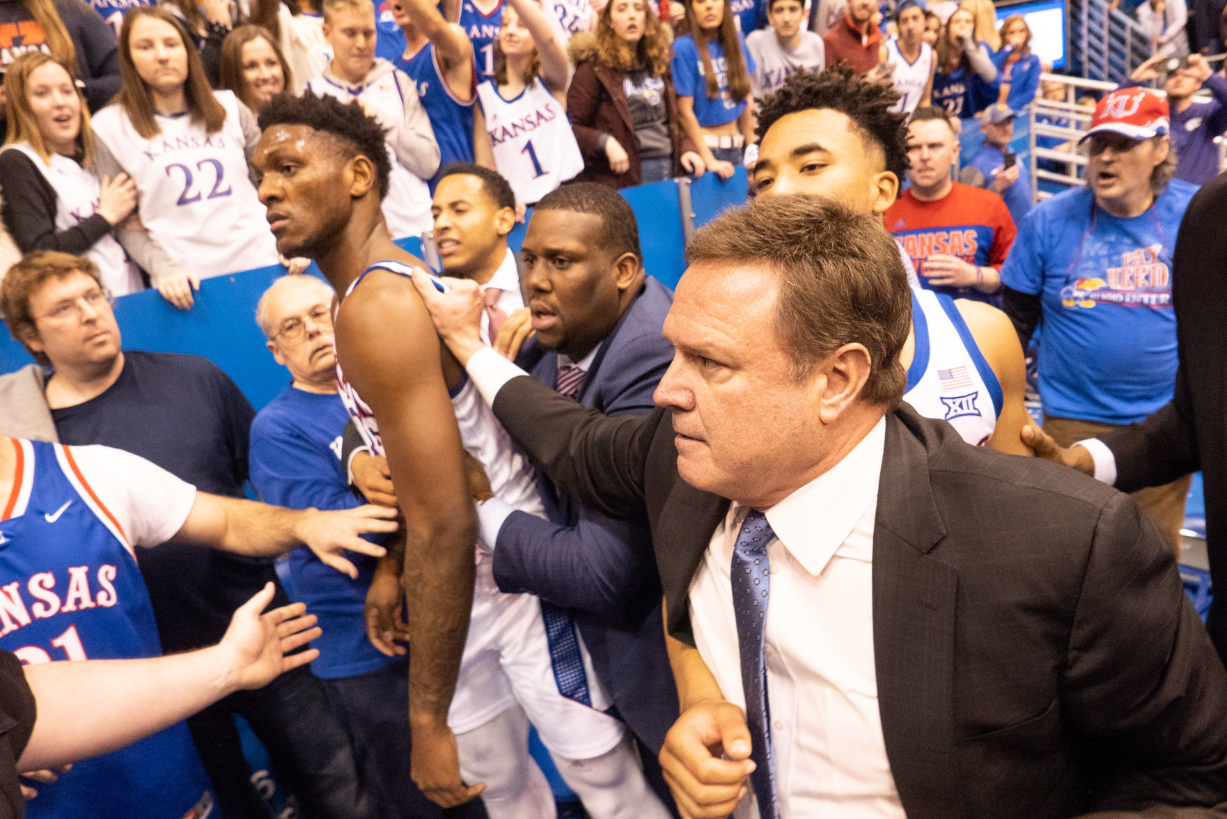 Kansas University head coach Bill Self grabs Silvio De Sousa (22) by the jersey after a fight broke out between KU and K-State.